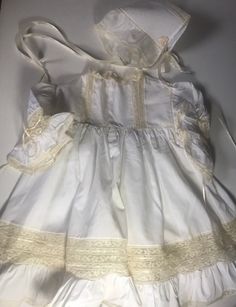 "Amazing beyond belief pictures due this no justice/sleeve length 5 1/2\"/pit to pit 12 1/2\"blouson/length (shoulder to bottom) 19 1/4\"/Comes with a matching bonnet/no issues spotless/A one of a kind gown/Amazing Seamstress /smoke free environment/3 plastic snap buttons on back(6)" Vintage Cotton Prairie Dress For Costume, Spring Vintage Dress With Ruffles For Costume, Cottagecore Dresses For Vintage Events, Vintage Ruffled Costume Dresses, Vintage Costume Dress With Ruffles, Vintage Spring Costume Dresses, Vintage Dresses For Costume Spring Festival, Vintage Victorian Cotton Dress With Ruffles, White Cotton Victorian Dress Costume