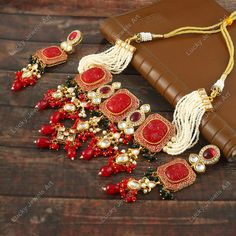 This is a stunning handmade choker necklace perfect for high end Jewelry Collector, a keeper in Traditional Vintage Indian/Pakistani Bridal jewelry and a Luxury Gift for your Daughter, Sister or Wife on Wedding or Anniversary. Perfect for any type of occasions, weddings And celebrations and a beautiful & memorable gift for weddings and special occasions. Description  Item Code:-  Gold Plated Carved Flower & Red Onyx Beaded Choker Necklace Necklace Measures- Adjustable with a Dori/Cord Earring Measures- 100x25mm approx Quantity- One Necklace Set Please see more different designs here:- https://www.etsy.com/in-en/shop/LUCKYJEWELSART?ref=seller-platform-mcnav I make every item of my collection with a lot of love and care, I pay attention to every detail.  You are more than welcome to contact Cuff Necklace, Necklace Fancy, Handmade Choker Necklace, Pakistani Bridal Jewelry, Handmade Chokers, Flower Red, Diamond Choker, Beaded Cuff, Onyx Bead