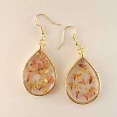 Handmade Resin Earrings With Real Pressed Flowers And Gold Flakes. Dangling Style And Pm For A Custom Order Jewelry Real, Flower Ear, Gold Flakes, Resin Earrings, Real Flowers, Pressed Flowers, Flower Earrings, Earrings Handmade, Red Gold