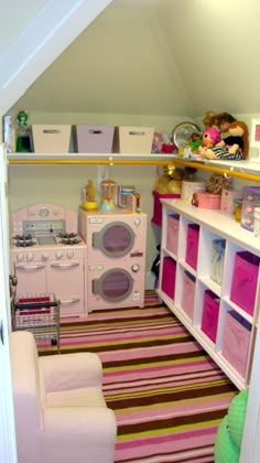 a room that has some toys and other items in it, including a washer and dryer