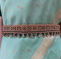 "Areya collections offers unique collection of items. Beautiful Maggam/embroidery work cloth Indian ethnic-wear waist belt (Vaddanam) for Adults Excellent accessory for women Indian wear (Saree, Half-saree,lehenga or dresses) for parties, weddings and events. Looks very pretty and attractive. This fabric waist belt is a perfect match on Wedding Sarees & Lehanga Cloth Vadanam Vaddanam Vadanalu Vadanallu Ottyanam Kardhani Kamarbandh For ladies Suitable to wear on Saree, Half-saree, nice frocks or long frocks or Lehenga's or Pattu Langa or Langa Voni or western dresses This embroidery Saree belt can be a perfect gift for your Girl Friend daughter mother sister fiancée bride. This can be a good gift or return gift for any girl/women for wedding , pooja, house warming or any event. This can be Maggam Work Hip Belts, Women Indian Wear, Saree Belts, Indian Wear Saree, Saree Belt, Hip Belts, Pattu Langa, Dresses For Parties, Langa Voni