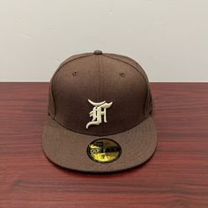 Brand - New Era X Fear Of God Hat Model - 59fifty Hat Type - Fitted Color - Brown & White Condition- Brand New Sizes Available 7, 7 1/2, 7 1/4, 7 1/8, 7 7/8 Flat Crown Fitted Hat For Streetwear And Baseball Season, Flat Cap For Baseball Season Streetwear, Classic Flat Crown Fitted Hat For Baseball Season, Brown Snapback Hat For Baseball Season Streetwear, Brown Fitted Baseball Cap, Brown Flat Brim Baseball Cap For Sports, Brown Flat Brim Hat For Baseball Season, Flat Crown Hats For Baseball Season, Classic Flat Crown Hat For Baseball Season