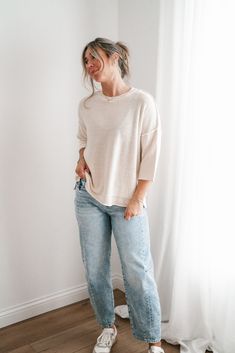 Elevate your casual wardrobe with the Evening Stroll Sweater Top, a versatile and chic piece that transitions effortlessly from day to night. This top is crafted in a soft cream knit that exudes subtle elegance. Its crew neckline is complemented by wide ribbed detailing, while the dropped shoulder seams and slouchy sleeves add to its laid-back vibe. The cozy knit texture gives it a timeless, casual charm, making it perfect for layering or wearing solo on cool evenings. Fabric: 100% Cotton Produc Versatile Relaxed Fit Knit Top For Loungewear, Relaxed Cream Tops For Fall, Beige Knit Top For Loungewear, Chic Relaxed Fit Knit Top For Everyday, Cream Soft Knit Tops For Layering, Chic Soft Knit Top With Relaxed Fit, Effortless Relaxed Fit Sweater For Everyday, Effortless Relaxed Fit Everyday Sweater, Cozy Beige Knit Top For Spring