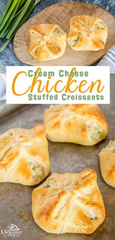 chicken stuffed croissants on a baking sheet with green onions in the background