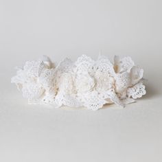 Lace lovers unite! Brides who are head over heels for all things lace with a dreamy, romantic bridal style vibe, look no further! Our 'In The Mood For Lace' style wedding garter is the perfect bridal accessory and wedding heirloom to lace, oops, we mean love, forever. Details Production Shipping Sizing Main Garter: Light ivory satin background with two layers of scalloped ivory luxury lace and detailed with a set of three ivory mini flowers with a pearl in the center of each flower (approx. 3 in Delicate White Lace For Wedding Night, Adjustable Lace Bridal Accessories For Ceremony, Cream Lace Bridal Accessories, Lace Bridal Accessories For Ceremony, Cream Lace Bridal Accessories For Wedding, White Lace Bridal Accessories For Bridal Shower, White Bridal Accessories With Lace Trim, Adjustable Lace Bridal Accessories For Wedding, White Lace Bridal Accessories