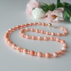 A beautiful TENEREZZA necklace, made of pink Pacific coral of two types, is without any color enhancement. Large balls are of Pleurocorallium elatius (true angel skin only with the uneven color) and small ones are of Hemicorallium laauense also known as deep sea. Large coral balls are 7mm. (this is already a remarkable size for natural coral!) Small pellets are between 4-4.5 mm. The length of the necklace is 50 cm. Necklace weight is 26 grams. The clasp is in gold-plated 925 silver. Complete Ita Real Angels, Natural Coral, 925 Silver, Coral, Beaded Necklace, Gift Card, Etsy Accessories, Accessory Gift, Electronic Accessories