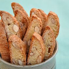 several pieces of bread in a bowl on a blue tablecloth with the rest of it's crusts