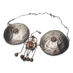 Turkmen Silver Pectoral Adornment Chain Length 24" Plate Diameter 5 1/2" Approx 90% Silver Created sometime early to Mid 20th Century with significant signs of use and wear. Fine Silver Adornments in this style are extremely rare. This would have represented a significant part of a Woman's Dowry Jewelry and has a relation to Fertility and Health. Vintage Festival Medallion Jewelry, Vintage Medallion Jewelry For Festival, Vintage Medallion Jewelry For Festivals, Traditional Jewelry With Historical Design For Collectors, Traditional Medallion Jewelry With Historical Design, Traditional Collectible Necklace For Festivals, Antique Silver Necklace With Historical Design, Traditional Medallion Necklace For Collectors, Traditional Pendant Necklace With Historical Design