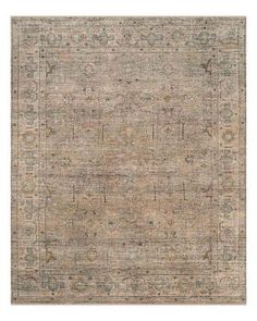 an area rug with various colors and patterns on the floor, including beiges, browns, and blue