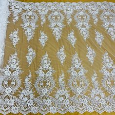 an image of white lace on yellow background