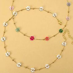 Summer Multi-Beaded Flower Charm Necklace, a vibrant accessory to brighten up your look for the sunny days ahead! This exquisite necklace boasts a delightful arrangement of colorful beads intricately woven together, culminating in a charming floral centerpiece. Each bead radiates summer vibes, bringing a burst of joy and style to any outfit. DIMENSIONlength: 15"ext: 3" Ball Chain Extclasp: Lobster Clawmetal finish: Gold Platedproduct: Lead & Nickel Compliantanti-tarnish: Double E-coating Trendy Multicolor Necklace With Flower Charm, Summer Flower Charm Necklace As A Gift, Summer Flower Charm Necklace For Gift, Summer Flower Charm Necklace As Gift, White Flower Necklace With Colorful Beads For Summer, Summer Gift Necklace With Flower Charm, Trendy Multicolor Beaded Flower Necklace, Summer Flower Charm Jewelry, White Summer Flower Necklace With Colorful Beads