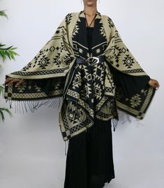 This gorgeous shawl is an easy throw and go addition. It’s tribal elements are woven into the garment. Great way to add a cozy, yet stylish finish to any outfit. Choose the black side or tan side…either way you are sure to look culturally chic. Belt not included. One Size Fits All Chic Belt, Black Side, One Size Fits All, The Black, Shawl, To Look, That Look, Black