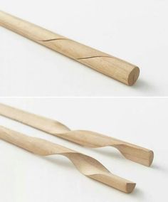 two wooden toothbrushes sitting next to each other