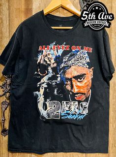 #tupac #2pac #rapper #hiphop #politicalhiphop #westcoasthiphop #tee #tshirt #streetwear #vintagereprint #vintaget #y2k #shopvintage #thrift #thriftshop #90sstyle #vintageclothing #vintaget #bootleg Vintage Band Shirts, Vintage Band T Shirts, Tshirt Streetwear, All Eyez On Me, Moving To Los Angeles, Gangsta Rap, Tupac Shakur, American Rappers, Vintage Band