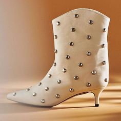 Introducing our Beige Pointed Toe Studs Ankle Boots, designed for women seeking both style and comfort. These kitten-heeled booties combine elegance with a touch of edgy sophistication. Color: Beige Heel Type: Kitten heel Heel height: 2 inches / 5 cm Toe: Pointed toe These boots feature cutting-edge studs and a low-profile stiletto heel. Handcrafted US sizing.Fits true to size. Cowboy Shoes, Booties For Women, Dance Heels, Studded Ankle Boots, Boots Square Toe, Beige Heels, Suede Boots Knee High, Wedge Boots, Heel Type