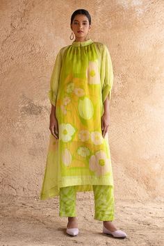 Lime green A - line kurta featuring floral print. Paired with a pant and an inner. - Aza Fashions Bohemian Green Sets For Spring, Bohemian Green Spring Set, Fitted Pista Green Kurta For Summer, Green Cotton Silk Kurta For Summer, Green Straight Kurta Set For Summer, Pista Green Silk Kurta For Spring, Bohemian Style Pista Green Kurta For Spring, Green Bohemian Cotton Silk Sets, Green Silk Sets For Spring