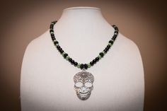 Unique green and black beaded necklace with large metal skull pendant. Silver Star Bracelet, Black Beaded Necklace, Metal Skull, Rose Bracelet, Black Bead Necklace, Skull Necklace, Skull Pendant, Star Bracelet, Flower Bracelet