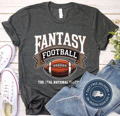 a t - shirt that says fantasy football the final national game is on it next to jeans and sneakers