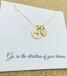 "Graduation Necklace Necklace is all 14k gold filled and customized with the letter of your choice. This is a hand stamped 14k gold filled compass necklace with a 1/2\" 18g 14k gold filled disc with a compass symbol with hammered edges  and an 8mm 14k gold filled disc with a stamped initial. Comes with a 18\" gold filled  cable chain. Please provide the following at checkout in message to seller box: -Initial you  want stamped Each letter has been individually hand stamped. Because of this, the lettering may have slight variations in the spacing, depth of the impression and the alignment. This is the nature of hand stamped jewelry and part of its charm. Back of disc can't be stamped. To check out more personalized items from our shop please click here https://www.etsy.com/shop/UniquelyImpr Adjustable Hand Stamped Gold Charm Necklaces, Adjustable Gold Hand Stamped Charm Necklaces, Gold Inspirational Hand Stamped Charm Necklace, Inspirational Gold Hand Stamped Charm Necklace, Hand Stamped Gold Jewelry For Best Friend, Hand Stamped Gold Necklace For Best Friend, Everyday Gold Jewelry With Compass Design, Compass Symbol, New Bern