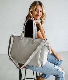 The Aquila Tote Bag perfectly blends sophisticated design and everyday practicality. Made with high-quality vegan leather, this tote is thoughtfully designed for the modern woman who values style, organization, and conscious living. The Aquila Tote boasts a spacious interior with multiple compartments, making it effortless to carry your essentials—from your laptop to your favorite notebook—without compromising on elegance. The sleek silhouette and polished hardware add a timeless touch, while th Chic Diaper Bag With Adjustable Strap, Chic Diaper Bag With Adjustable Strap For Daily Use, Modern Leather Shoulder Diaper Bag, Everyday Leather Tote Diaper Bag, Everyday Leather Shoulder Diaper Bag, Everyday Large Capacity Leather Diaper Bag, Large Capacity Leather Diaper Bag, Modern Leather Diaper Bag For Everyday Use, Everyday Satchel Diaper Bag With Leather Handles