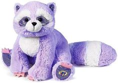 a purple stuffed animal sitting on top of a white floor