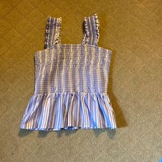 Size Medium Smocked And Stretchy Never Worn Cotton Smocked Top With Ruffles For Vacation, Blue Stretch Smocked Top For Spring, Chic Blue Smocked Top With Smocked Back, Chic Blue Smocked Back Top, Chic Blue Smocked Top, Casual Cotton Smocked Top For Beach, Blue Casual Smocked Top With Smocked Back, Blue Smocked Top With Smocked Back For Spring, Blue Stretch Top With Smocked Back