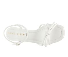 These beautiful bow sandals will instantly transform any outfit and become a style staple. Opt for a city chic look and pair with cropped denim or wear with an elevated maxi for weddings and fun nights all year long. Anne Klein iFlex technology allows for a 180 degree flex with every step. Man made upper, Ankle strap with adjustable buckle closure,2\ block heel, Square toe, iFlex technology provides 90-degree bend for superior comfort and flexibility, Comfort padded insole, Bow detail | Women's Spring Synthetic Heels With Bow, Spring Ankle Strap Sandals With Bow Straps, Summer Evening Sandals With Bow Straps, Evening Sandals With Bow Straps For Summer, Trendy Bow Sandals For Spring, Trendy Spring Sandals With Bow, White Bow Sandals For Spring, Summer Evening Sandals With Bow, Chic White Sandals With Bow