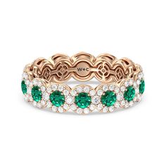 a rose gold ring with green and white stones in the center, surrounded by diamonds