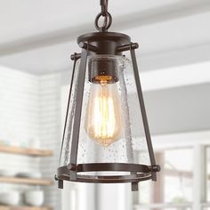 a light fixture hanging from the ceiling in a kitchen