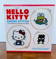 the hello kitty cross stitch book is on display