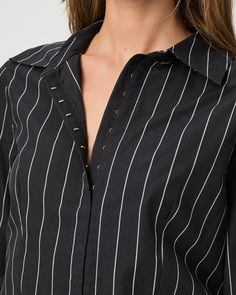 Made from supremely soft 100% cotton, this classic black and off-white striped long sleeve shirt is designed with a hook-and-eye closure and a flattering, fitted silhouette with a front notch. | Rosaly Shirt - Black/Buttercream | Size 14 Classic Long Sleeve Tops With Vertical Stripes, Fall Pinstripe Long Sleeve Tops, Classic Long Sleeve Pinstripe Tops, Spring Pinstripe Long Sleeve Shirt, Elegant Black Top With Vertical Stripes, Pinstripe Long-sleeved Shirt With Button Closure, Black Shirt With Vertical Stripes For Spring, Spring Pinstripe Long Sleeve Blouse, Chic Pinstripe Cotton Shirt