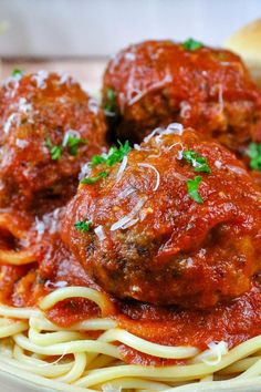 spaghetti with meatballs and parmesan cheese on top