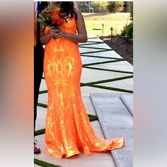 Jovani Orange 3263 Sequin Sheath 2022 Prom Dress Size 8 Petite Worn Once Neon. This Dress Was Professionally Altered (Hemmed) For A 5'2 Girl Wearing 3 Inch Wedge Heels. Nothing Else Was Altered. Train Is Intact. This Fits Almost All Body Types Like A Glove As It Has Some Stretch. Has Built In Pads In The Busy Area. Zip And Eye Hook In The Back. Not Only Drop Dead Gorgeous But Is Comfy! Hem Has Some Stiffness To It So It Keeps Its Shape. The Under Slip Was Not Hemmed Just Raw Edge. Ask For More Pics If Needed. I Ship Within 24 Hours 2022 Prom Dress, Jovani Dresses, Eye Hook, 2 Girl, Drop Dead, Neon Color, Girls Wear, Raw Edge, Wedge Heels