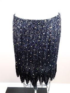 "This is a fun vintage skirt fully embellished with sequins and glass beading. It's in excellent condition! Measurements: Waist - 29\" Hips - 38\" Length - 14-19\" All of my items come from a smoke-free and pet-free home. If you would like more info or have any questions, please don't hesitate to ask!" Fitted Party Bottoms With Beaded Fringe, Sequined Mini Skirt For Evening, Embellished Skirt For Party Season, Embellished Mini Skirt For Evening, Embellished Party Skirt For Party Season, Party Season Embellished Skirt, Glamorous Mini Skirt With Rhinestone Fringe For Party, Evening Mini Skirt With Sequins, Glamorous Evening Skirt With Rhinestones