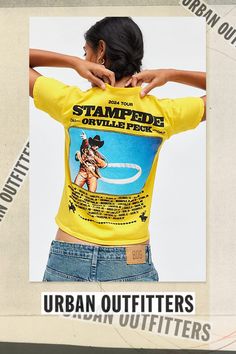 Baby tee in a slim & cropped fit featuring Orville Peck Stampede tour graphics across the front & back. Designed with a crew neckline and cap sleeves with western-inspired graphics for a country vibe. Only at Urban Outfitters. Features Orville Peck Stampede Tour graphic baby tee Fitted graphic tee Soft & stretchy cotton knit Crew neckline and short sleeves Stampeding horses graphic across the chest Orville Peck tour graphics across the back Shrunken, slim fit Cropped length Easy pull-over style UO exclusive Content + Care 100% Cotton Machine wash Imported Size + Fit Model in Yellow is 5’8" and wearing size Medium Measurements taken from size Medium Chest: 30" Length: 19" | Orville Peck Stampede Tour Graphic Baby Tee in Yellow, Women's at Urban Outfitters Summer Band Merch Cropped T-shirt With Graphic Print, Trendy Tops With Front And Back Print, Summer Band Merch Cropped T-shirt With Crew Neck, Retro T-shirt With Back Print For Summer, Band Merch Cropped T-shirt For Summer, Summer Band Merch Cropped T-shirt, Summer Band Merch Cropped T-shirt With Short Sleeves, Urban Outfitters Crew Neck T-shirt For Summer, Retro Fitted Crew Neck Cropped T-shirt