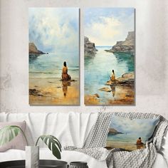 two paintings on the wall of a living room