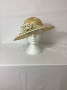 Vintage 1960s does 40s straw summer sunhat with flower and ribbon romantic #VD Natural colour  Fine woven straw with detailing 100% Sisal  Decorative flower detail  Cream ribbon around crown Retro 40s romantic style Oval shaped brim Chin strap to secure Pretty vintage ideal for summer, holidays, weddings, the races etc Perfect for current romantic, boho and cottagecore trends Made in England No label  Size: 55cm Condition:  Good vintage condition.  Please keep in mind that our items are vintage Adjustable Straw Hat With Ribbon For Garden Party, Wide Brim Sun Hat With Ribbon For Garden Party, Garden Party Wide Brim Sun Hat With Ribbon, Vintage Straw Hat For Spring Wedding, Vintage Cream Straw Hat For Vacation, Vintage Straw Boater Hat For Garden Party, Straw Hats For Spring Weddings, Cream Straw Hat For Garden Party, Vintage Summer Wedding Boater Hat