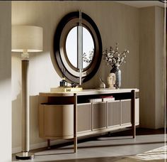 a living room with a round mirror on the wall next to a dresser and lamp