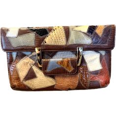 "Such an unusual shoulder bag from the 1970's in patchwork leather with genuine Snakeskin. A very expensive purse in it's day, it is being offered today for a bargain!  The design is quite unusual with a front handle that closes with a snap. Features an inside side pocket that zippers closed and a slip pocket.  There is a chain shoulder strap that can be tucked in to use it as a clutch. The condition is very good, the skins are not dry, still supple and soft. The cloth lining is very clean.  Say Expensive Purses, Snake Skin Bag, Leather Patchwork, Leather Bag Women, Wedding Bag, Long Chain, Snake Skin, Leather Purses, Bags Women