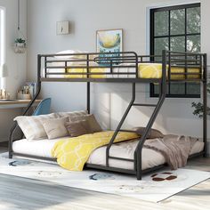 a bunk bed sitting next to a window in a bedroom