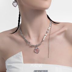 Add a touch of sweetness and elegance to your look with our Strawberry Pendant Necklace. Crafted in silver tone, this necklace features a delightful heart-shaped pendant in a soft pink hue, resembling a luscious strawberry. Surrounding the necklace are delicate freshwater pearls, further enhancing the necklace's elegance and sophistication. The silver tone of the necklace provides a sleek and versatile look, making it easy to pair with a variety of outfits and styles. The pendant hangs gracefull Trendy Pearl Chain Necklace For Valentine's Day, Valentine's Day Party Pearl Necklace, Heart-shaped Pearl Charm Necklace For Party, Heart Shaped Pearl Charm Necklace For Party, Trendy Pearl Jewelry For Valentine's Day, Trendy Valentine's Day Pearl Jewelry, Heart-shaped Pearl Necklace For Party, Party Pearl Necklace With Heart Charm, Pearl Necklace With Heart Charm For Parties