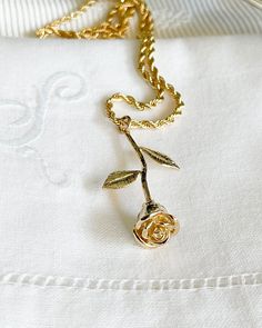 The Rose Necklace is such a poetic piece! A long stem rose in delicate gold has a beautiful classy look and feel. The perfect staple for the romantic dreamer. Makes a wonderful gift. Gold plated Rose 33mm, hangs from a gold plated brass 16-18 inch chain. All items come in a gift box ready to gift. https://www.etsy.com/shop/BijouLimon Bijou Limon jewelry collections present a romantic French spin on the latest jewelry trends. Based on the US West Coast but French at heart, Bijou Limon interprets Rococo Jewelry, Gold Rose Necklace, Long Stem Rose, Victorian Pendants, Latest Jewellery Trends, French Rose, Cute Gift Boxes, Unique Accessories, Rose Necklace