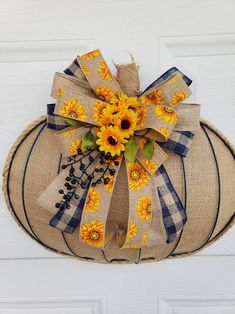 a burlock with sunflowers on it hanging from the side of a door