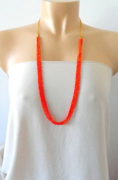 "Delicate and dainty long beaded orange necklace. It measures 30\". ❤ SHIPPING Please check shipping options and timeframe once you add item/s to the cart. In addition, you can click on the tab \"Shipping & Policies\" above for more information on processing time and cost. ❤ CUSTOM ORDERS If you like this item in a different color, send me a message indicating: color, size and quantity needed. I will send you a link for a \"custom order\" and you'll be able to place the order there. If you l Bohemian Orange Necklace For Wedding, Orange Multi-strand Colorful Beads Jewelry, Orange Beaded Long Necklace, Orange Multi-strand Beaded Necklaces, Handmade Multi-strand Orange Beaded Necklaces, Orange Multi-strand Beaded Necklace, Handmade Orange Beaded Necklace For Wedding, Long Orange Beaded Necklaces, Orange Multi-strand Beads As Gift