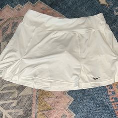 Nwot Nike Skirt With Built In Shorts Casual Nike Stretch Tennis Skirt, White Skirted Bottoms With Pockets, Nike Casual Short Tennis Skirt, Nike Casual Mini Skort, Nike Casual Tennis Skirt, Nike Mini Skirt For Spring, Nike White Fitted Tennis Skirt, Nike Casual Mini Skirt, Fitted White Nike Tennis Skirt