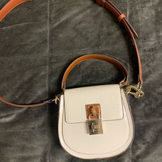 Never Used! White Crossbody Shoulder Bag With Silver-tone Hardware, Trendy White Bag With Silver-tone Hardware, Trendy White Shoulder Bag With Silver-tone Hardware, White Shoulder Bag With Silver-tone Hardware For Daily Use, Trendy White Satchel For Office, White Satchel With Silver-tone Hardware For Errands, White Office Bags With Silver-tone Hardware, White Crossbody Satchel With Silver-tone Hardware, White Crossbody Bag With Silver-tone Hardware