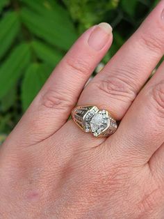 Vintage 14k Yellow Gold Trillion Cut Diamond Cluster Ring 1.67ct. T.w. Color H-J Clarity SI Size 7.25 with Appraisal Item w#2627 Professionally cleaned and polished to newer condition. .32 carat total weight Trillion Cut Diamonds (2) .60 carat total weight Round Cut Diamonds (24) .48 carat total weight Baguette Cut Diamonds. 1.67 carat total weight all diamonds Color H-J Clarity SI1 7.3 grams Marked 14k American Appraisal Association Estimated Retail Replacement Value $2395 USD We will provide 1 Anniversary Diamond Cluster Ring With Emerald Cut, Emerald Cut Diamond Cluster Ring For Anniversary, Baguette Cut Diamond Wedding Ring In Diamond White, Diamond White Emerald Cut Cluster Ring For Anniversary, Vs Clarity Baguette Cut Diamond Promise Ring, Diamond Cluster Ring Baguette Cut For Promise, White Marquise Cut Diamond Ring Fine Jewelry, 14k Gold Halo Ring With Center Stone For Anniversary, Dazzling Baguette Cut Rings For Anniversary