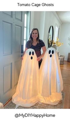 a woman standing in front of two ghost shaped lights with the caption, my diy happy home