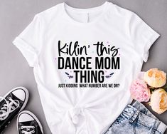 Dance Mom Shirt, Killin' This Dance Mom Thing T-Shirt, Just Kidding Mom Tee, Gift For Dance Mom, Dance Mom Life, What Number Are They On Tee Welcome to BelinayShirt,  Your ultimate destination for unique and stylish printed t-shirts! At BelinayShirt, we believe in expressing individuality through fashion. Our collection features a wide range of designs, from trendy graphics and bold statements to artistic prints and personalized options. Each shirt is crafted with high-quality materials to ensure comfort and durability. Whether you're looking to make a fashion statement or find the perfect gift, BelinayShirt has something for everyone. Discover your new favorite tee today and wear your personality with pride! Dance Shirts Ideas, Dance Team Shirts, Dance Mom Gifts, Hip Hop Festival, Dance Mom Shirt, Dance Mom Shirts, Funny Dance, Dance Mom, Cute Shirt Designs