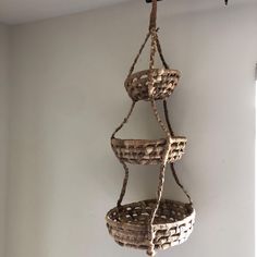 three wicker baskets hanging from the ceiling